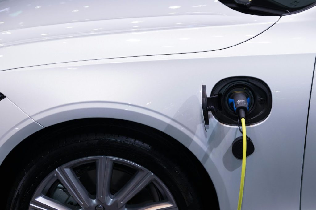 A white electric car charging.