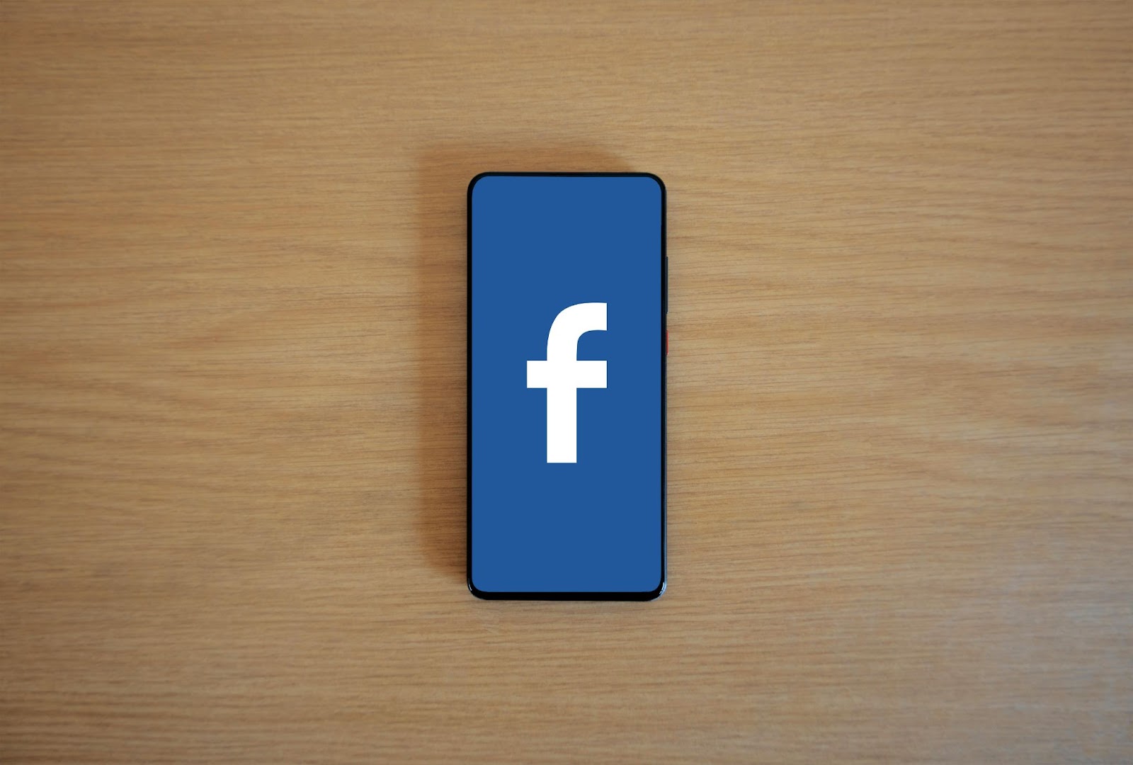 The Facebook logo on a smartphone.